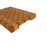 a wooden cutting board with a checkered pattern